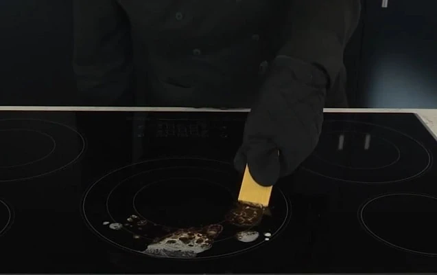how do you clean a burnt glass stovetop